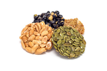 Korean traditional sweet snacks with peanuts, pumpkin seeds, black soybeans and chinese buckwheat, isolated