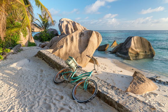 Bike parked on a beautiful tropical beach. Holiday concept