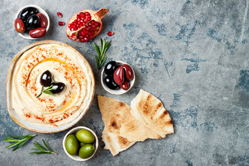 Homemade hummus with paprika, olive oil. Middle Eastern traditional and authentic arab cuisine....