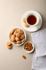Almond cookies in bowl and tea