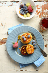 Breakfast pancakes with berries and honey