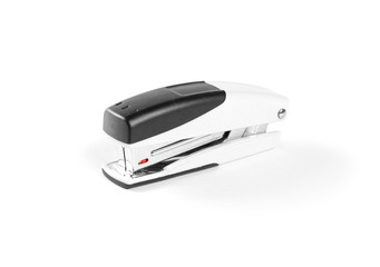 Stapler for paper on white background. Closeup