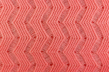 Pink wool knitted texture closeup. Natural wool fabric background