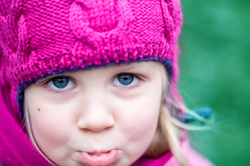 Portrait of little sad girl outdoor