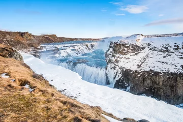 Raamstickers Gullfoss waterval uitzicht en winter Lanscape foto in het winterseizoen © BBandSIRI