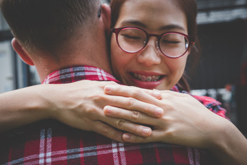 couple standing and holding each other. boyfriend & girlfriend dating in valentine's day. man & woman  hugging outdoor. relationship, lover lifestyle concept