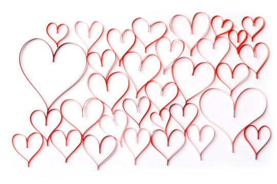 Abstract background of red contours of hearts on a white background. Concept on Valentine day or wedding.