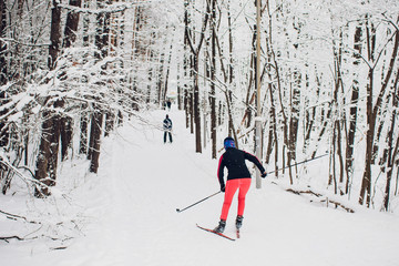 Nordic skier on the white winter forest covered by snow - concept photo for winter olympic game in...