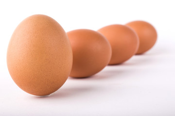 Five eggs are isolated on a white background