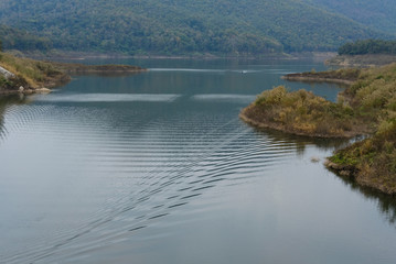 landscape of dam & forest on mountain. serene lake view