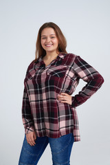 Gorgeous girl wearing jeans and shirt smiling at camera