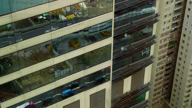 Traffic Reflected In Glass Building; Hong Kong Airport; Causeway Bay, Hong Kong, China