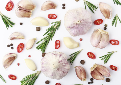 Garlic with rosemary, black pepper and chili isolated on white background. Isolated garlic