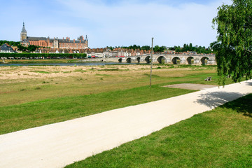 bridge and Gien city in Loire river in summer