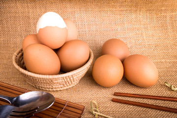 Set Eggs in a basket on  gunny (sackcloth)  background