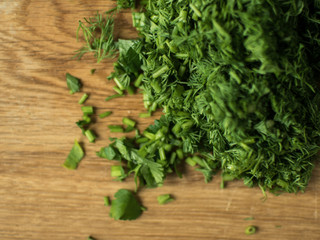 finely chopped greens on a chopping board.