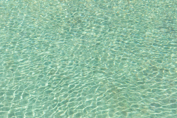 Green swimming pool rippled water detail