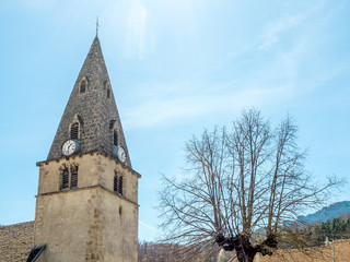 Fototapeta na wymiar Clock tower of Chichilianne church