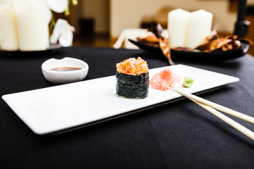 Spicy salmon sushi served on a plate