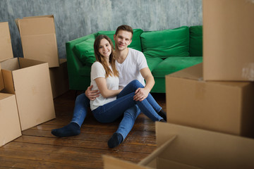 Young couple very happy and excited about moving into new apartment