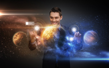 businessman with virtual planets and space