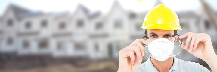Construction Worker on building site wearing mask