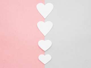 Mockup. Hearts from paper cards. Pink and gray paper background. Valentine's day concept.