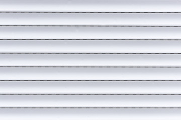Eine weiße Jalousie als Hintergrund