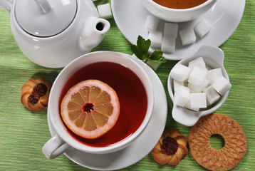 fruit tea with a cookie in white porcelain