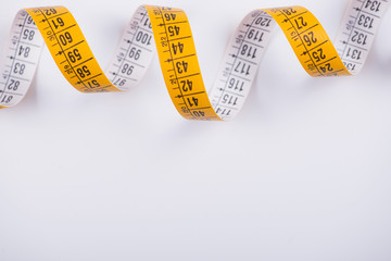 Measuring tape on white background. Isolated.