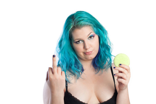 Fat girl with macaron cookie shows middle finger, fuck off