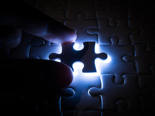 Missing Jigsaw puzzle piece with lighting, business concept for completing the finishing puzzle...