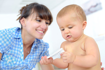 young mother with baby at home