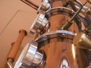 alembic still for making alcohol inside distillery, destilling spirits