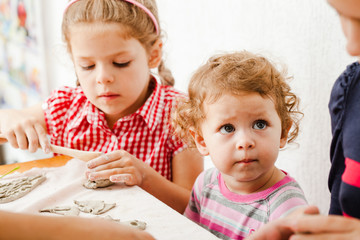 Child hands with plasticine