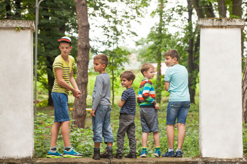 Fototapeta premium Group of guys in a row back view