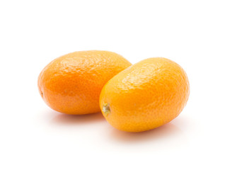 Two kumquat isolated on white background.