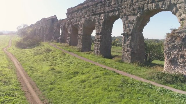 Aerial view of famous ancient roman aqueduct claudio landmark in parco degli acquedotti in rome drone slow motion dolly
