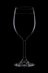 Red wine in a glass isolated on black background