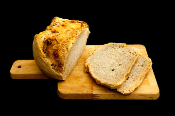 Sliced Bread on cutting table, black background