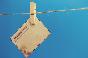 Envelopes of the message on a rope on a blue background.