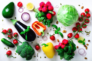 Set of fresh vegetables on a white background. Aromatic herbs, onion, avocado, broccoli, pepper bell, eggplant, cabbage, radish, cucumber, almonds, rucola, baby corn. Banner
