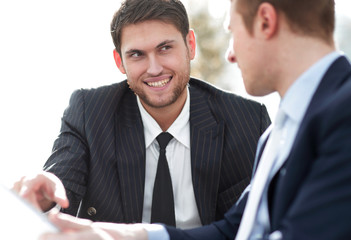 close-up.businessman talking to colleague.