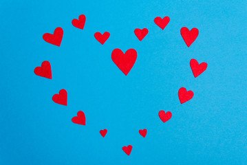 Hearts laid out on a blue background