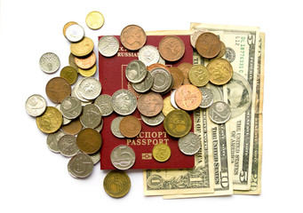 passport, dollars, coins of different countries, on white background .