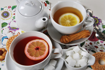 fruit tea with a cookie in white porcelain