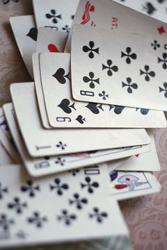 Deck of playing card spread out on a table