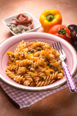 pasta with eggplant capers anchovies and capsicum, selective focus