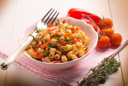 pasta with capsicum tomatoes and thymus,selective focus
