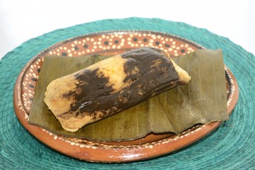 Mexican tamal from Oaxaca state made of chicken and mole sauce for Candelaria celebration on Febrary